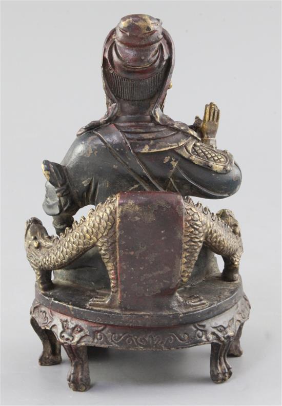 A Chinese polychrome decorated bronze seated figure of Guandi, probably Ming dynasty, height 21.5cm